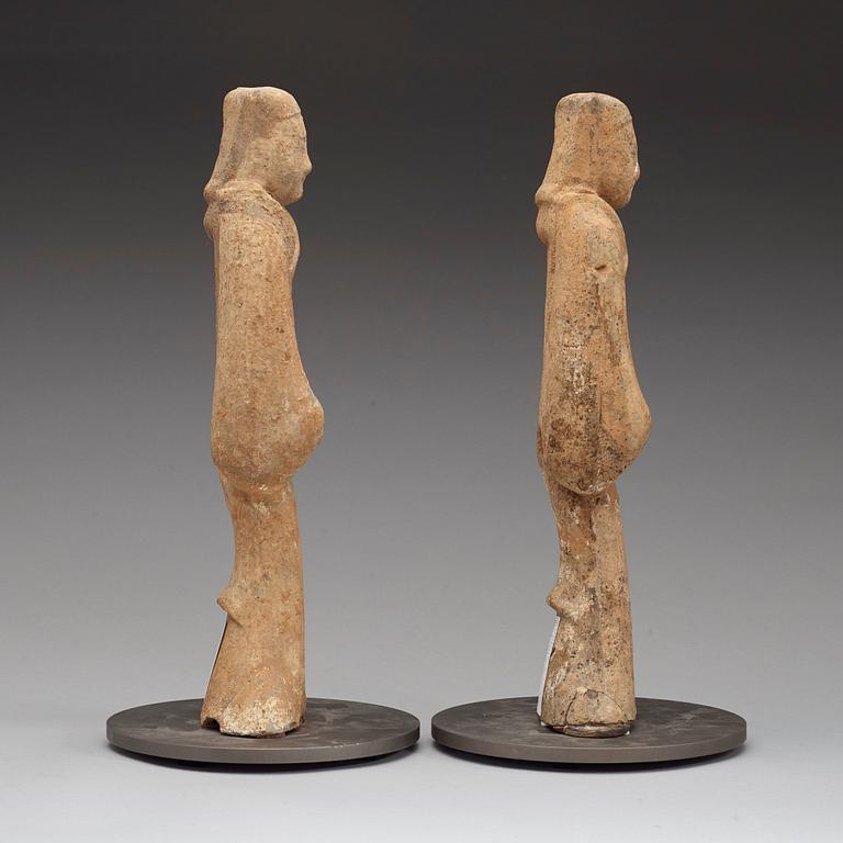 A pair of potted tomb figures of a guardiens, Han dynasty (206 B.C. - 220 A.D.).