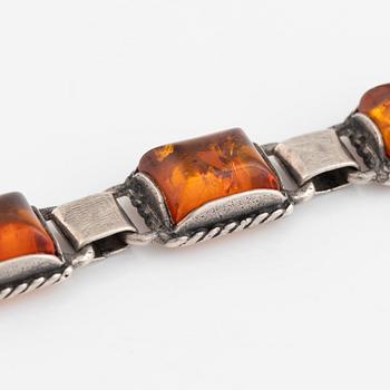 Silver and amber bracelet and earrings.