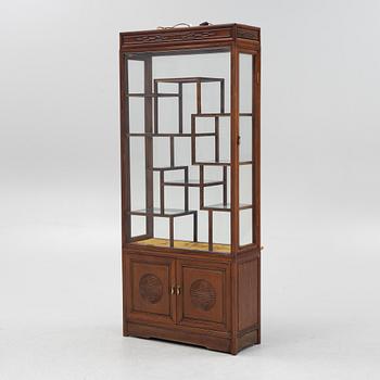 A Chinese hardwood cabinet, mid 20th century.