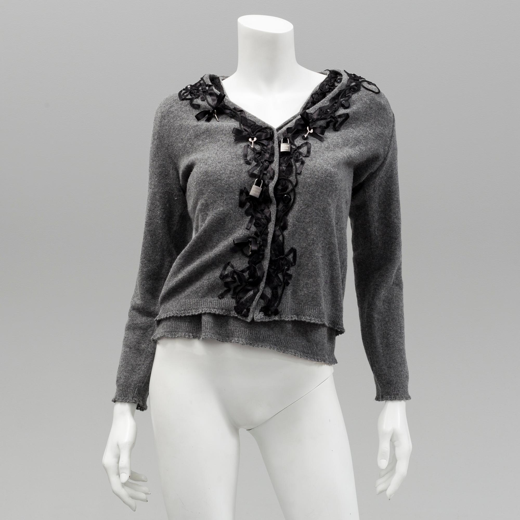 Cardigan and top by Moschino, Cheap and Chic.