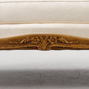 A Louis XV-style sofa, early 20th century.