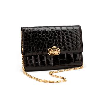 CÉLINE, a brown crocodile evening bag / shoulder bag with  shoulder strap.