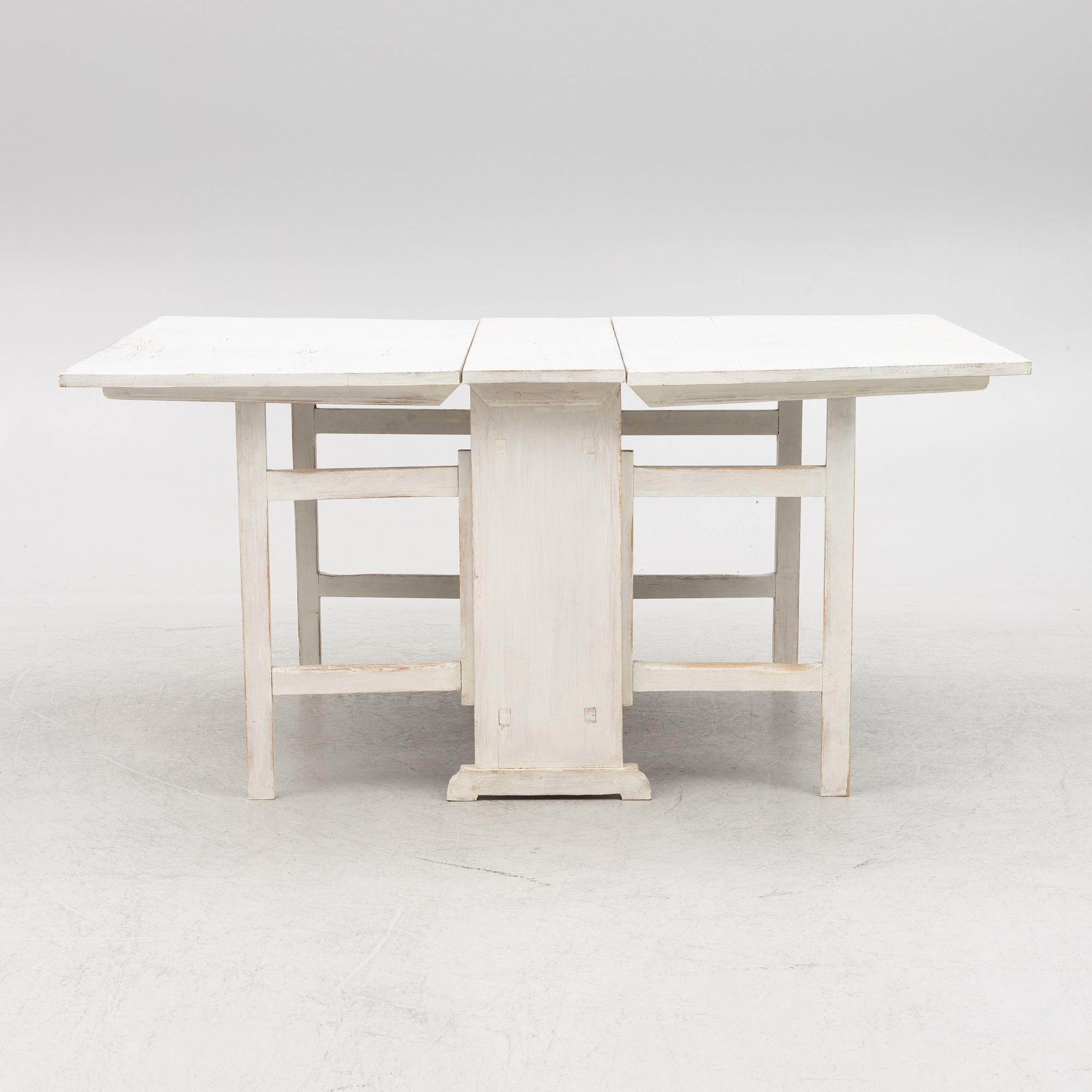 A drop-leaf table, late 19th century.