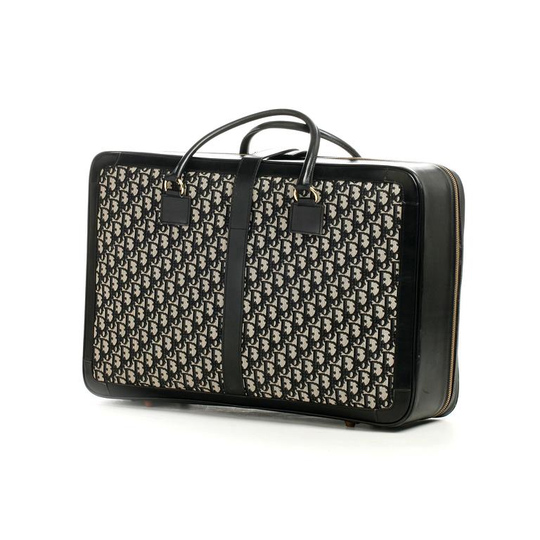 CHRISTIAN DIOR, a monogram canvas suitcase.