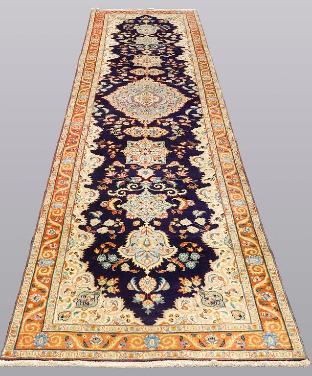A Tabriz runner, so called Tabatabai, ca 402 x 97 cm.