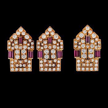 966. A clip and a pair of clip-on earrings with rubies and diamonds.