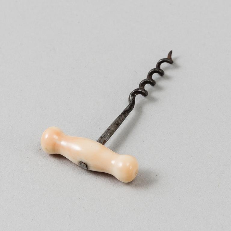 A 19th century bone and steel miniature corkscrew.