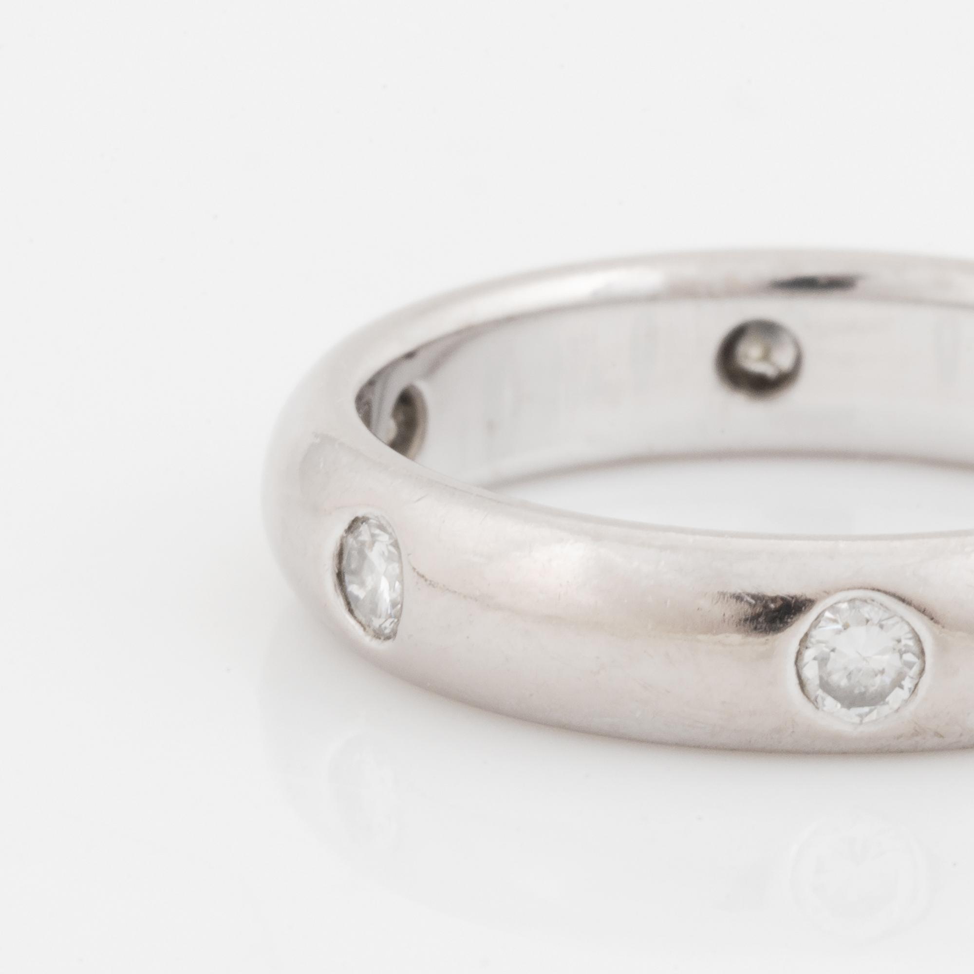 An 18K white gold Cartier ring set with round brilliant-cut diamonds.