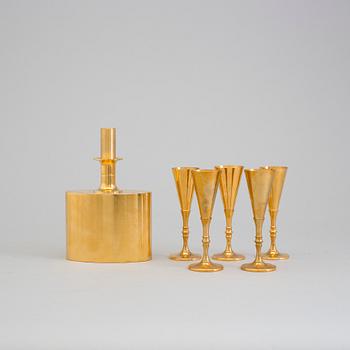 A gilt brass bottle and five glasses from Skultuna, 1989-96.