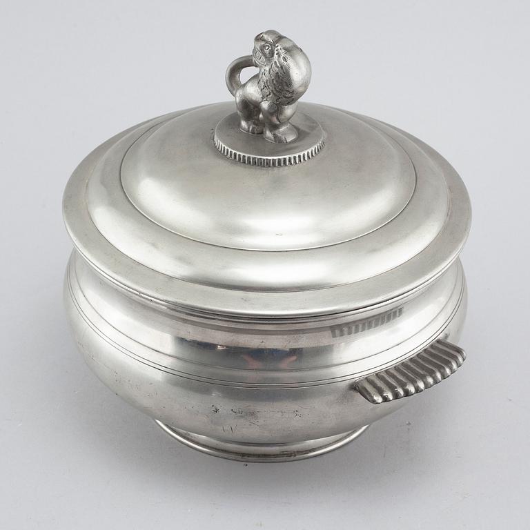 A lidded pewter terrine, model 277, Firma Svenskt tenn 1926. The lion probably designed by Anna Petrus.