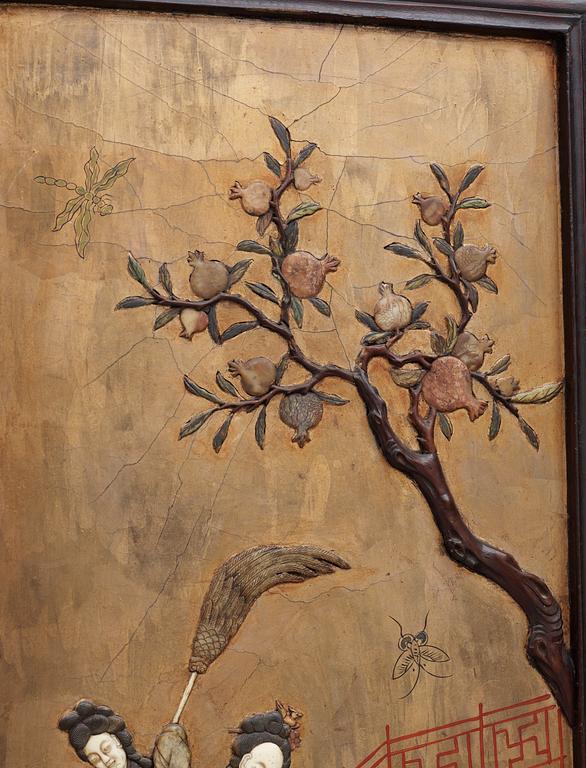 A four panel wooden and lacquered screen with inlays of stone and bone, late Qing dynasty (1912-1644).