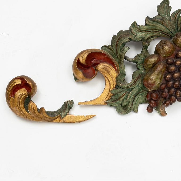 A carved and painted Baroque style wall decoration, 20th Century.