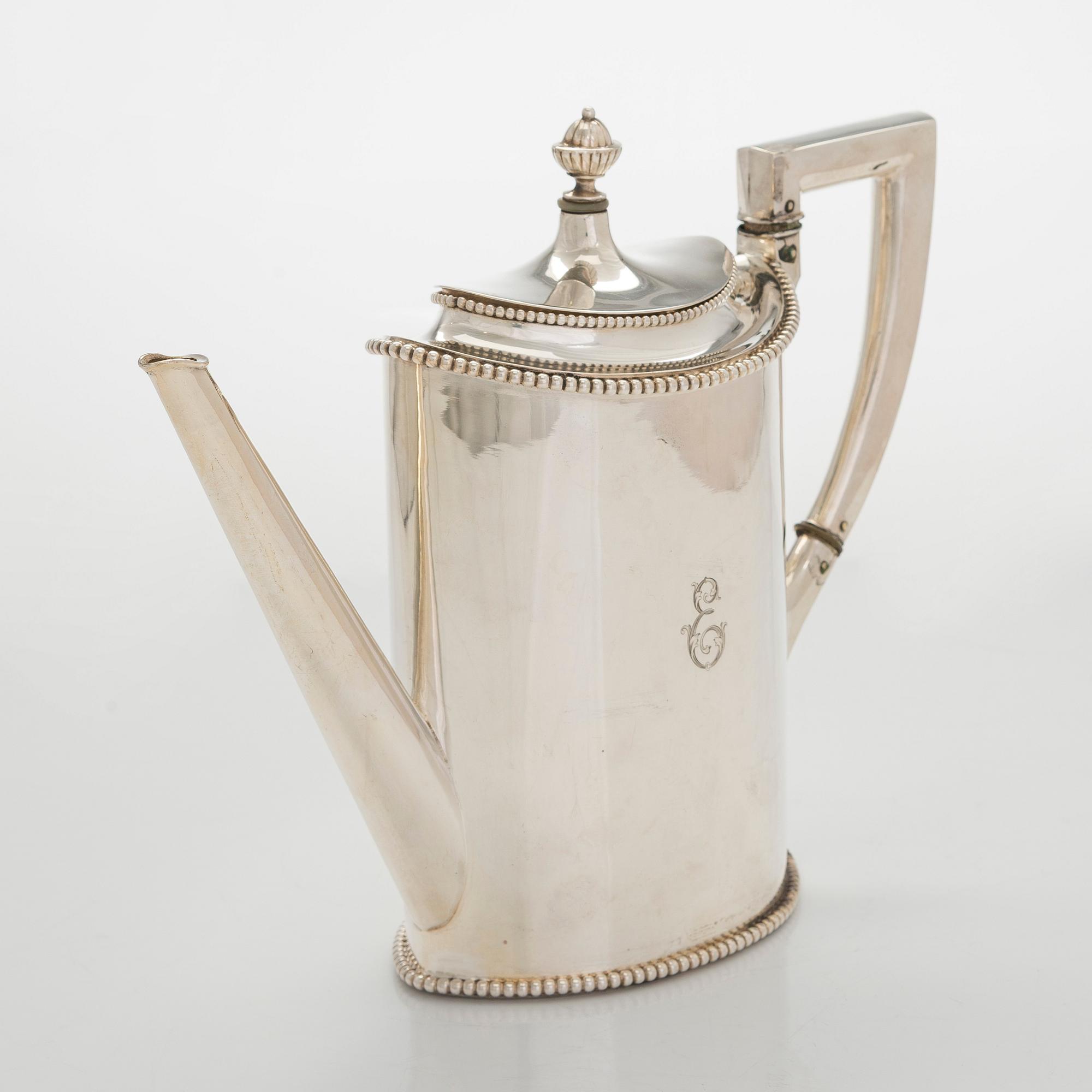 An early 20th century 4- piece sterling silver empire coffee set, C.G. Hallbergs Guldsmeds AB, Stockholm.