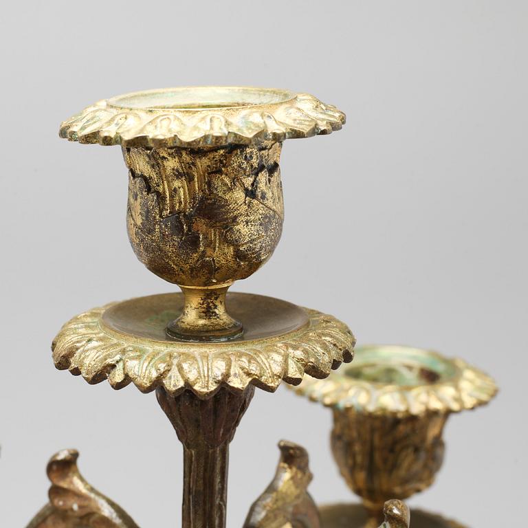 A pair of brass candelabras, 19th century.