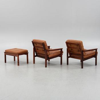Illum Wikkelsö, a pair of 'Capella' armchairs and an ottoman, second half of the 20th century.