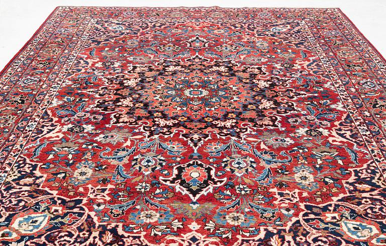 A Persian carpet. ca 400 x 260 cm.