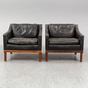 A pair of "The President" black leather armchairs by Ingemar Thillmark for OPE-möbler, Sweden.