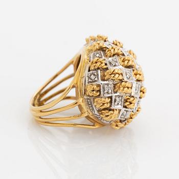 An 18K gold ring set with eight-cut diamonds.