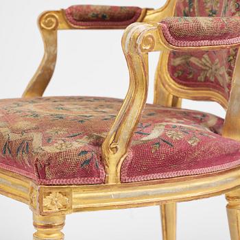 A pair of Gustavian giltwood open armchairs, Stockholm, late 18th century.