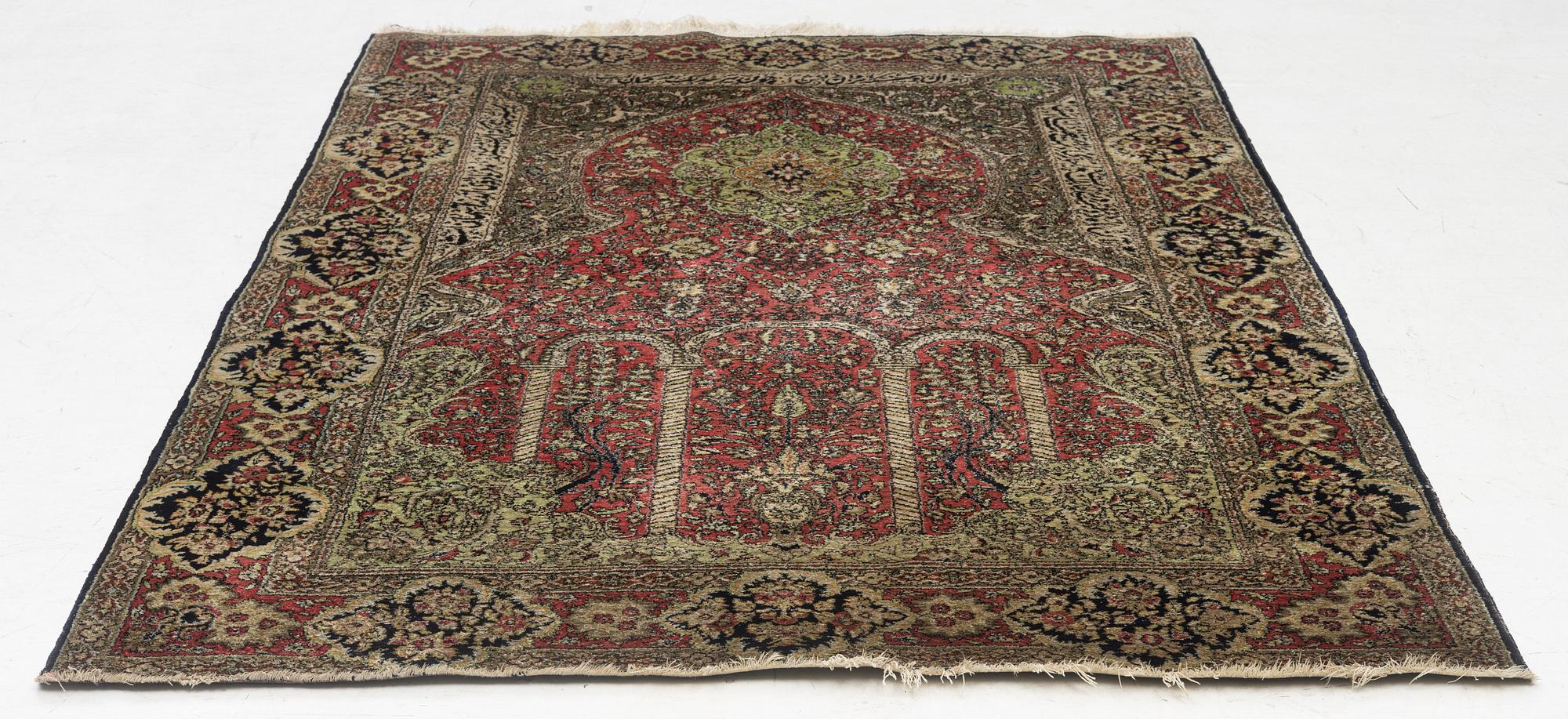 A semi-antique silk Quum, c. 216 x 141 cm.