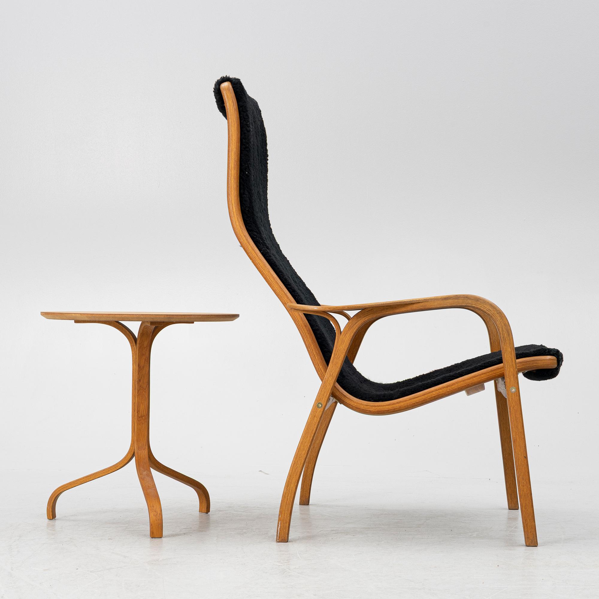 Yngve Ekström, a 'Lamino' armchair and sidetable, Swedese, Sweden, early 21st century.