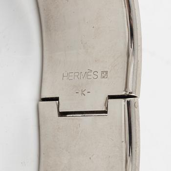 Hermès, a 'Clic Clac H' bracelet.