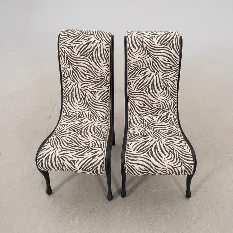 A pair of easy chairs around 1900.