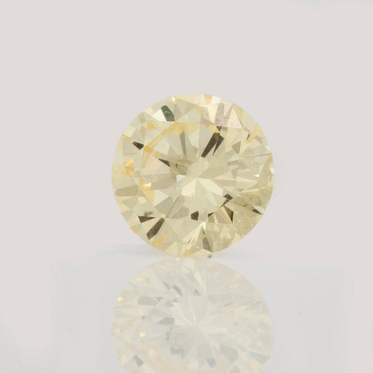 A 0.98ct fancy light yellow/VVS diamond.