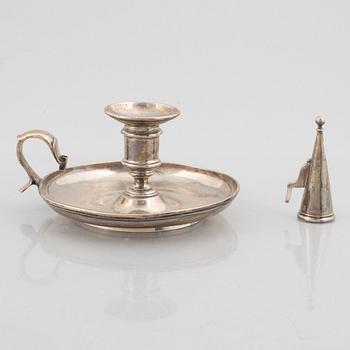 A silver chamber candlestick with mark of R & S Garrard & Co, London, England 1848.