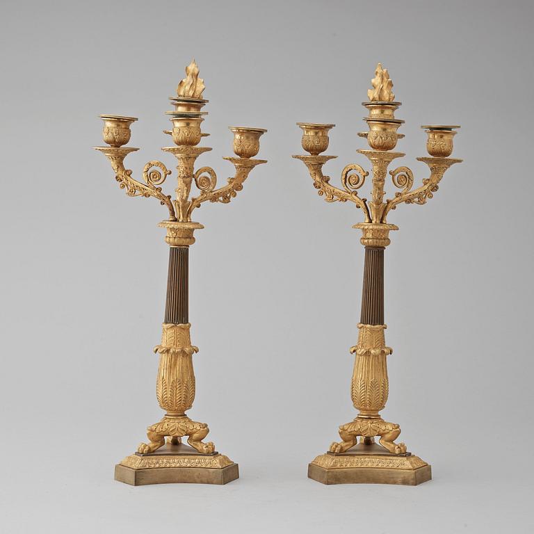 A pair of French Empire early 19th century four-light candelabra.