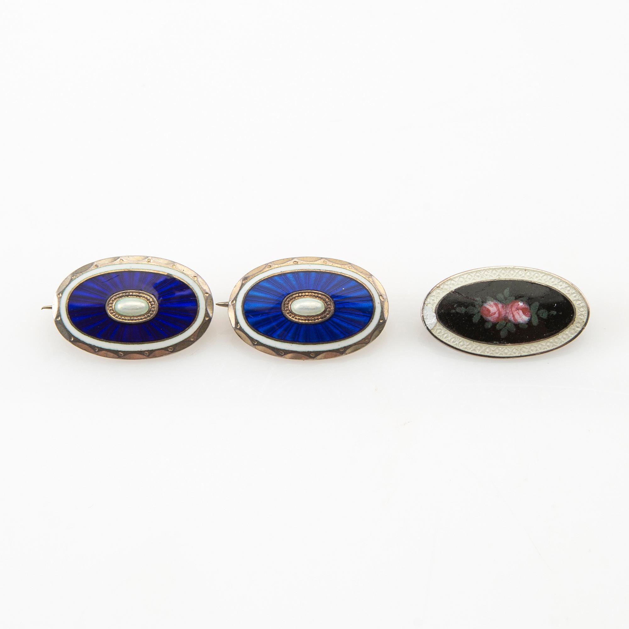 Two pendants and five brooches made of silver and enamel, including Aksel Holmsen, Norway, circa 1900.