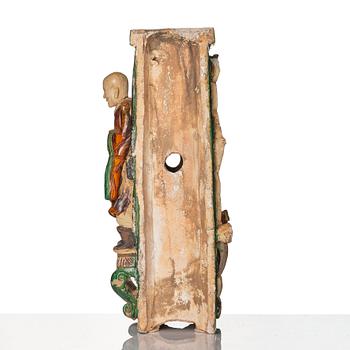A green and yellow glazed architectural element with a Lohan, Ming dynasty (1368-1644), dated 1536.