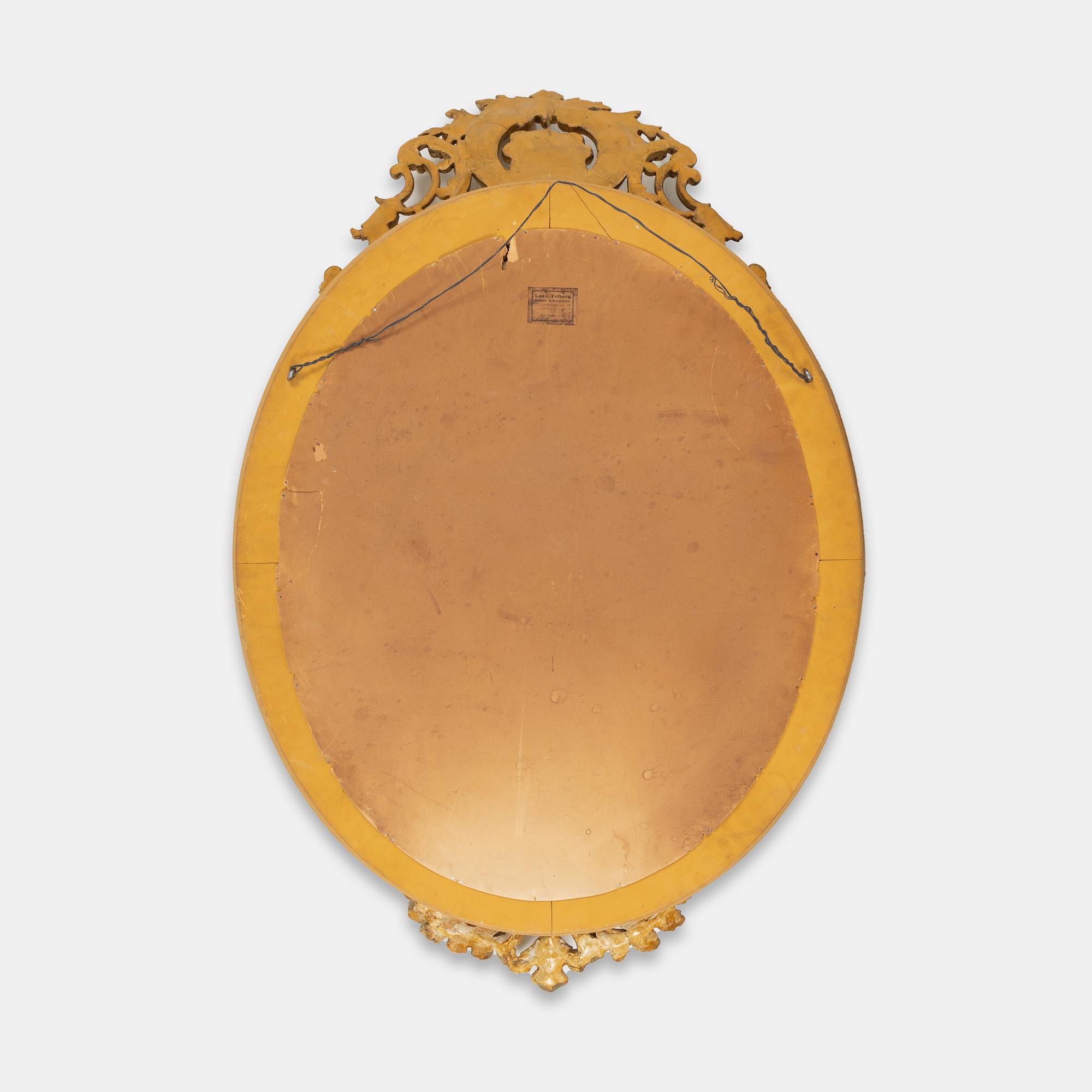 A Rococo style mirror, first half of the 20th Century.