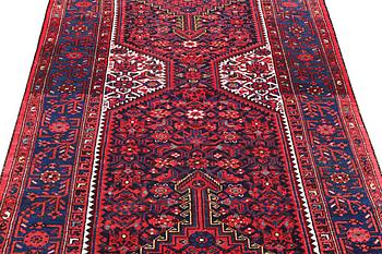 A Hosseinabad carpet, c. 391 x 135 cm.