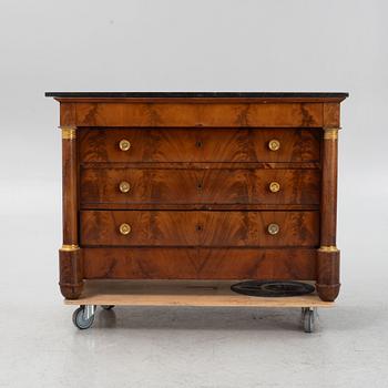 A French Empire mahogany and gilt brass mounted commode, early 19th century.