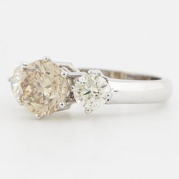 Fancy light yellowish brown round brilliant-cut diamond ring.
