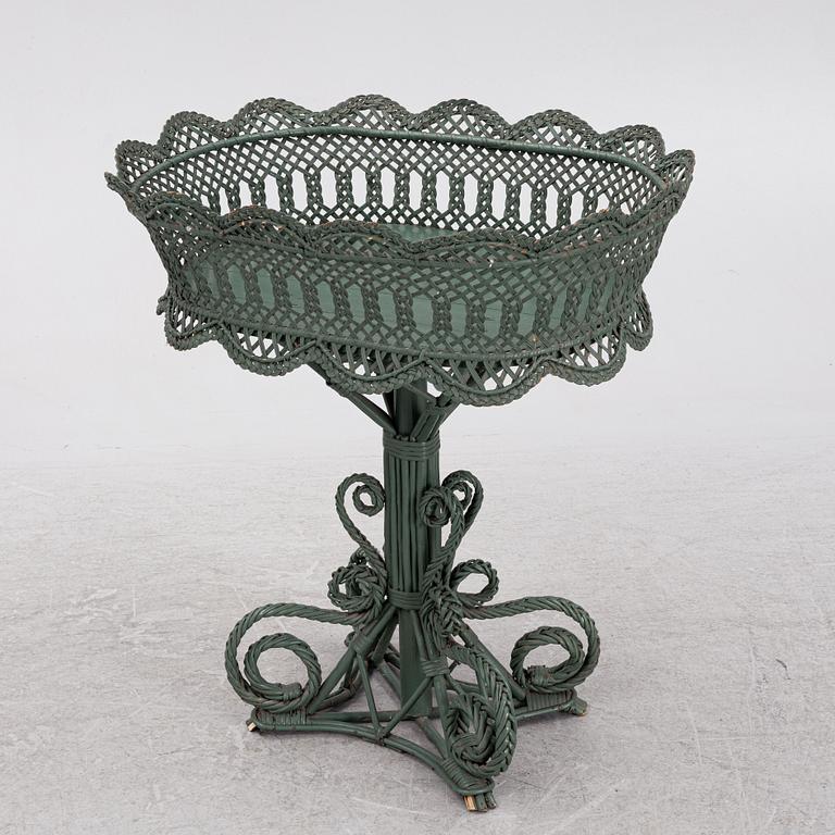 A wicker flower table, early 20th century.