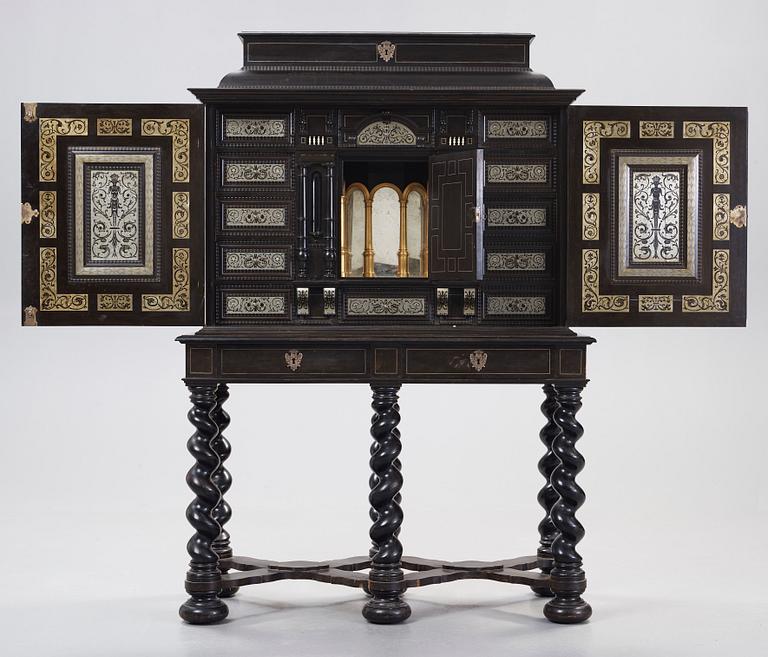 A Baroque-style circa 1900 cabinet on stand.