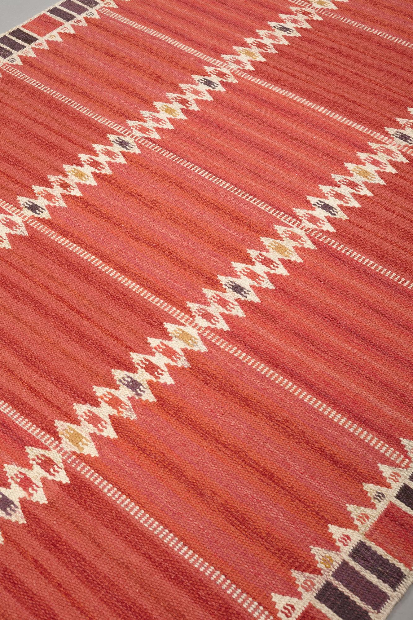 Barbro Nilsson, A CARPET, "Salerno kallröd med enkel bård", flat weave, ca 217 x 149,5 cm, signed AB MMF BN.