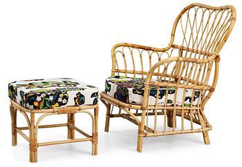 A Josef Frank ratten easy chair and stool, Svenskt Tenn, model 311.