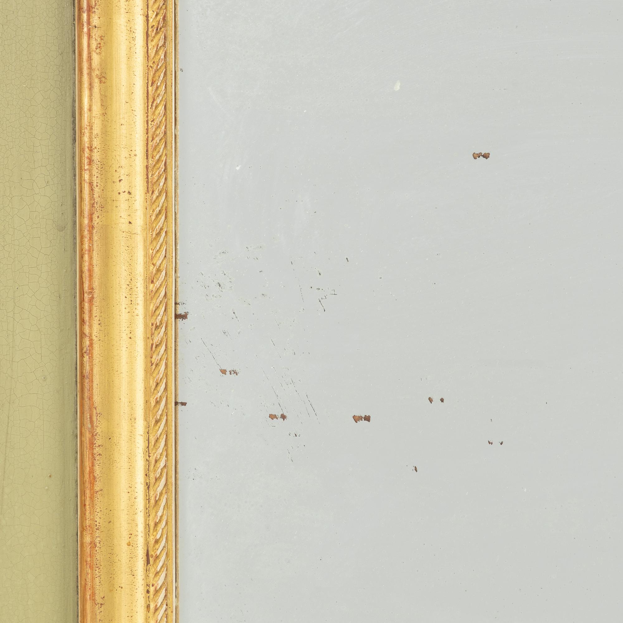 A Rococo style mirror, first half of the 20th Century.