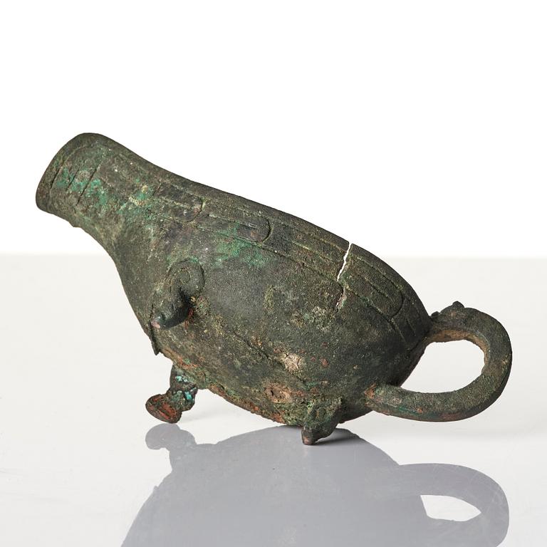 A Chinese brushpot, Qing dynasty, circa 1900. An archaistic bronze ewer and a silvered South East Asian bowl with stand.