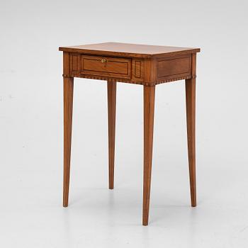 An elm wood veneered sewing table, early 19th Century.