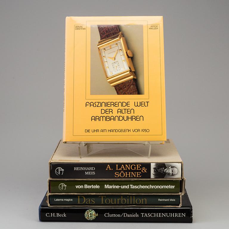 A set of 5 watch books.