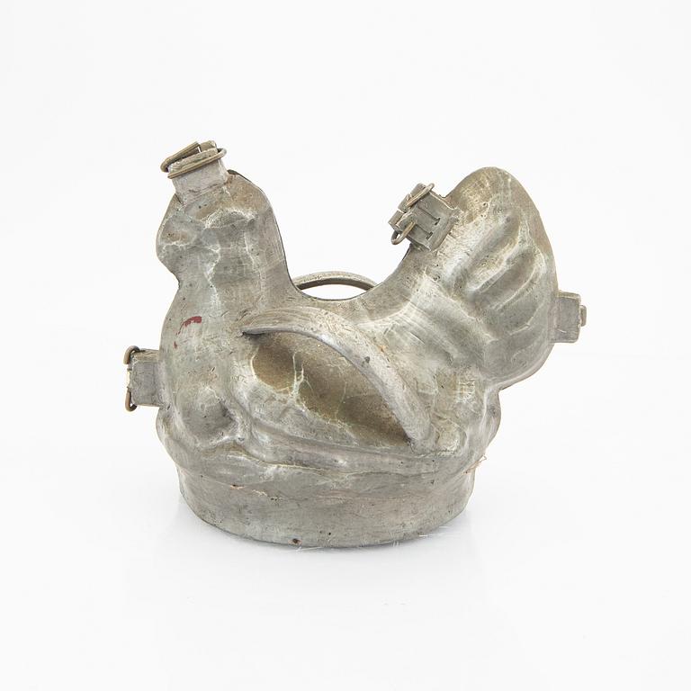 A set of four pewter icecream moulds around 1900.