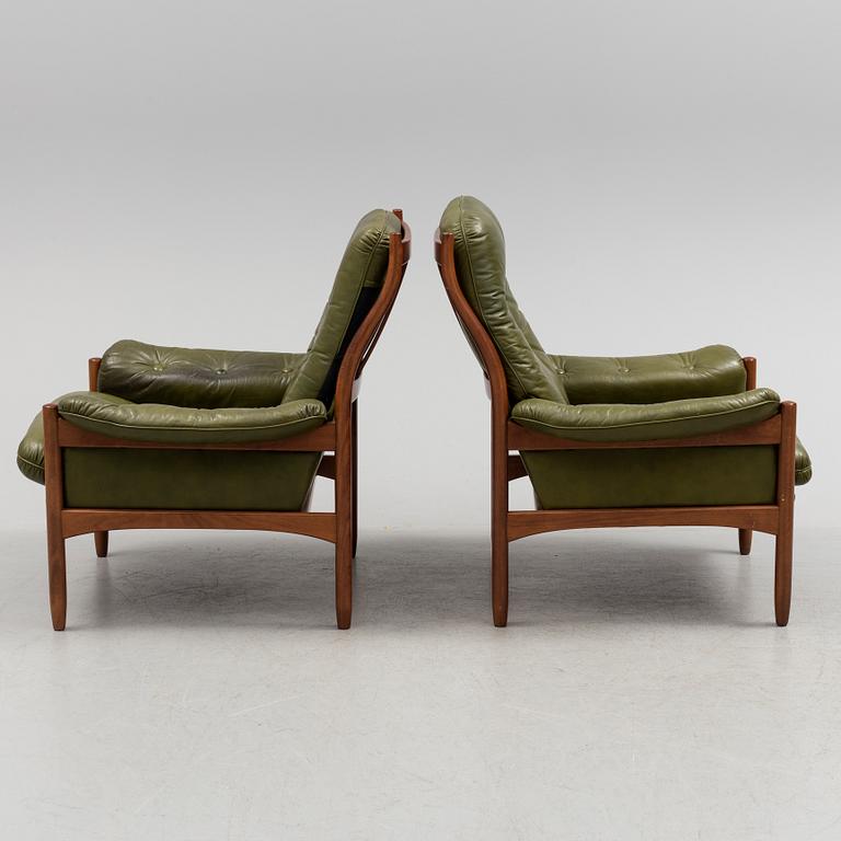 A pair of stained beech and leather easy chairs from Göte Möbler, Nässjö, second half of the 20th century.