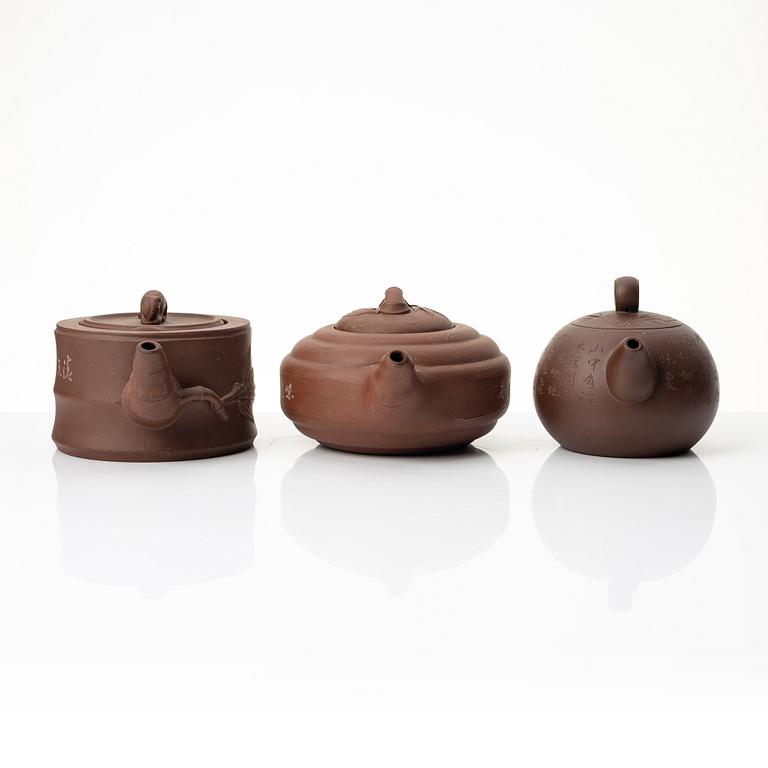 A group of three Chinese yixing teapots, 1960-80s.