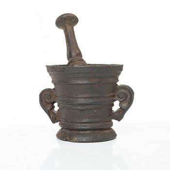 A cast-iron mortar and pestle of renaissance-type, 17th century.