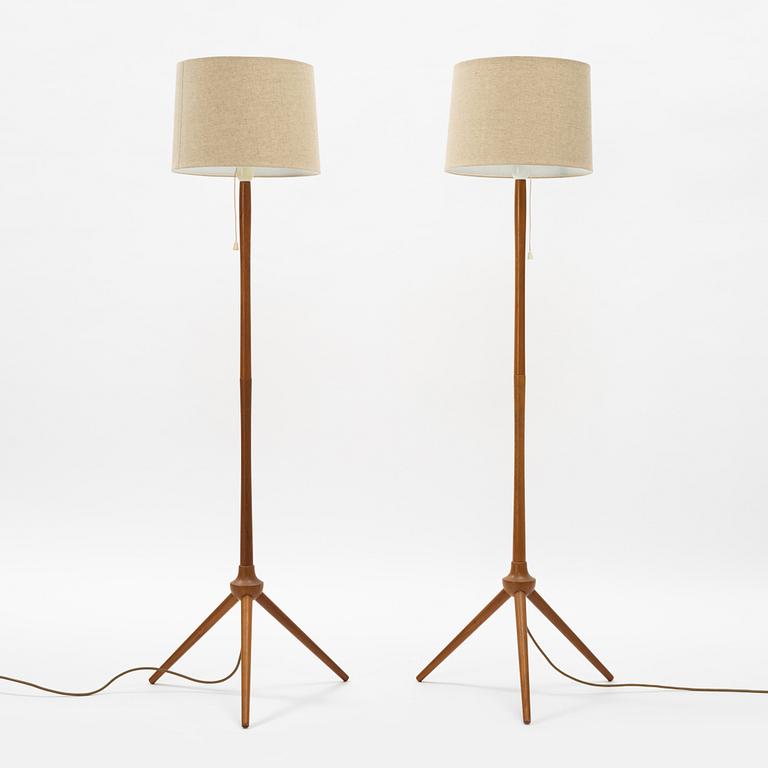 A pair of teak floor lamps, mid 20th century.