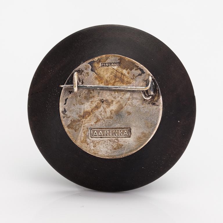 Kaija Aarikka, A necklace, a paid of earrings and a brooch made of silver and wood. Finland.